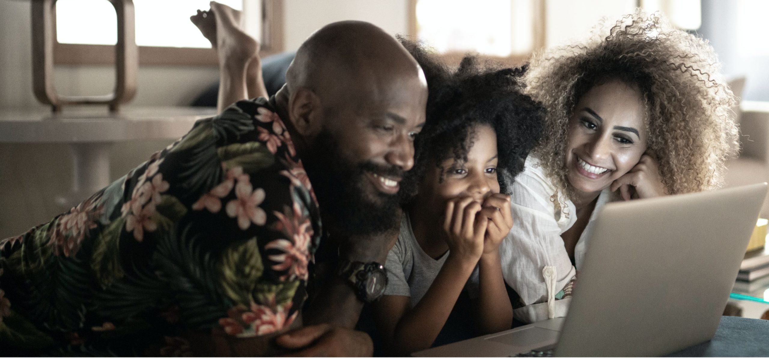African american family streaming content on their laptop