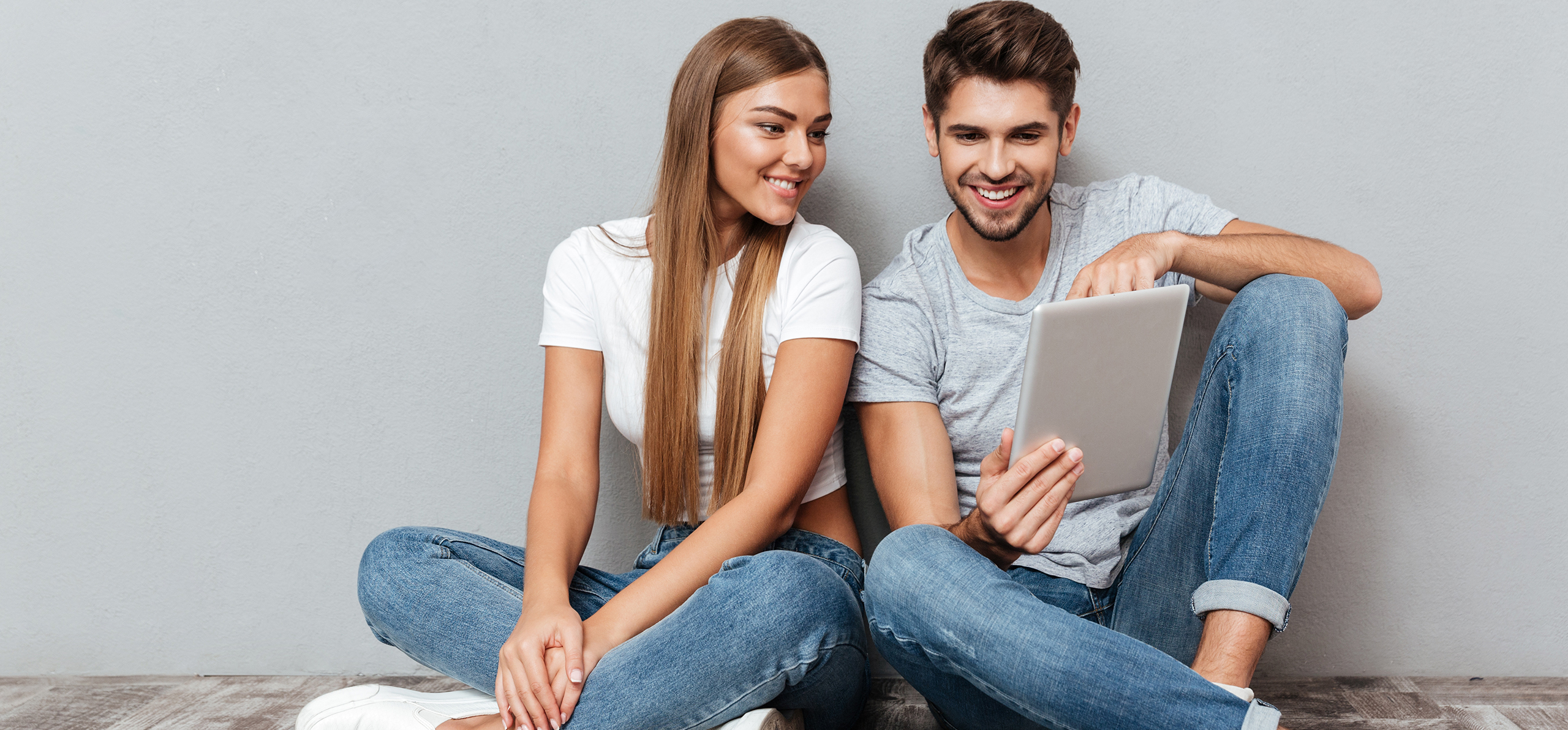 young couple using internet tablet
